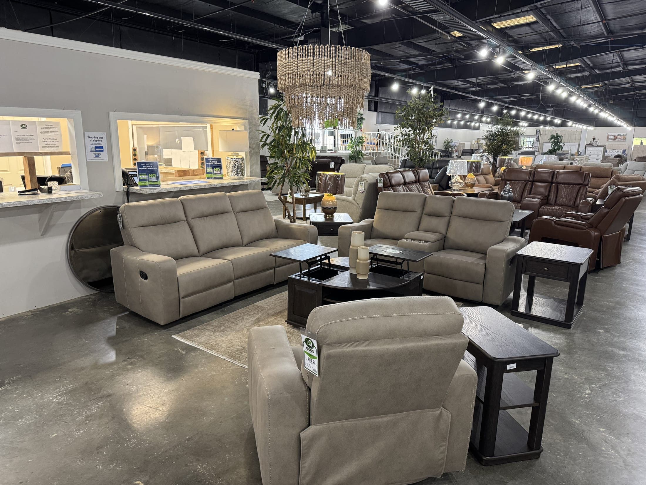 Gray power reclining sofa and loveseat with end tables and lamps
