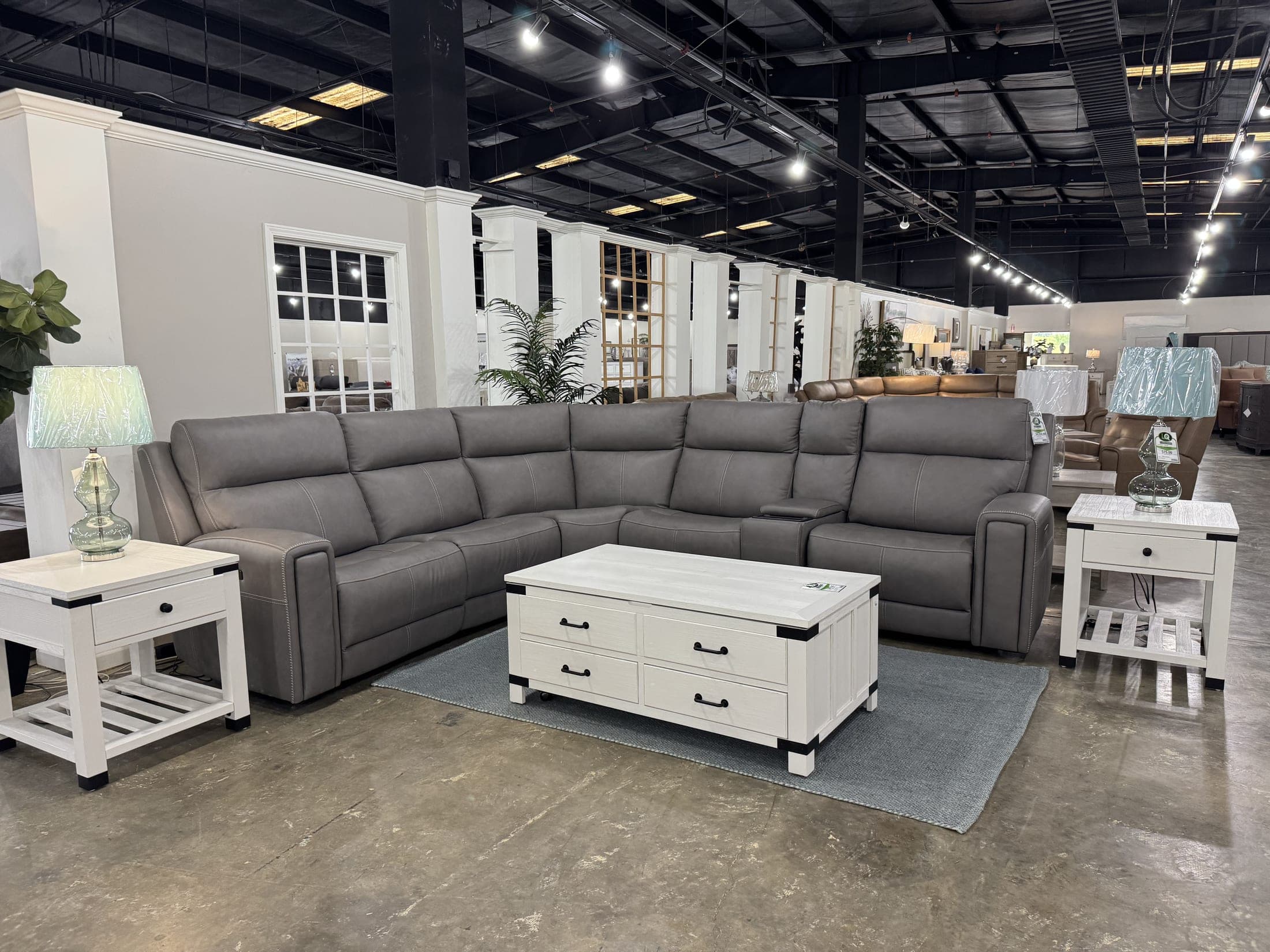 Gray sectional staged with white side tables