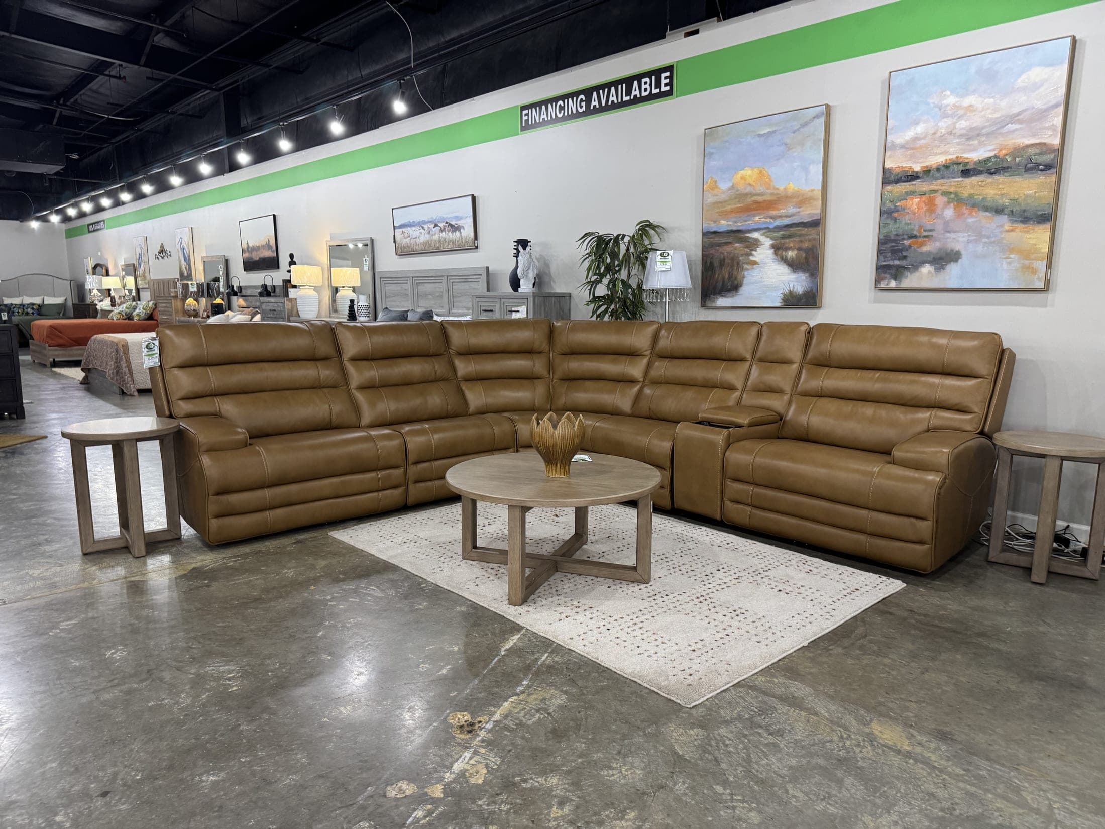 Caramel modular sectional arranged in an L on a woven rug